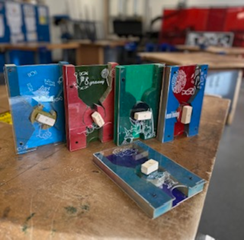 five pieces of metal on a table