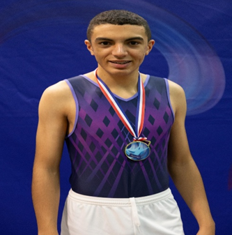 a student with a medal  