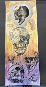 a drawing of four skulls