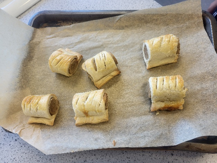 a tray of six sausage rolls