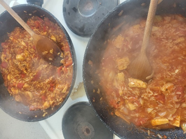two pans of Jambayla cooking