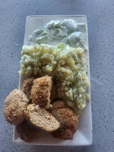 falfalel halved and rice on a plate