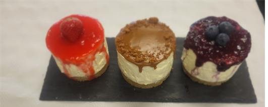 three cheesecakes on  a tray