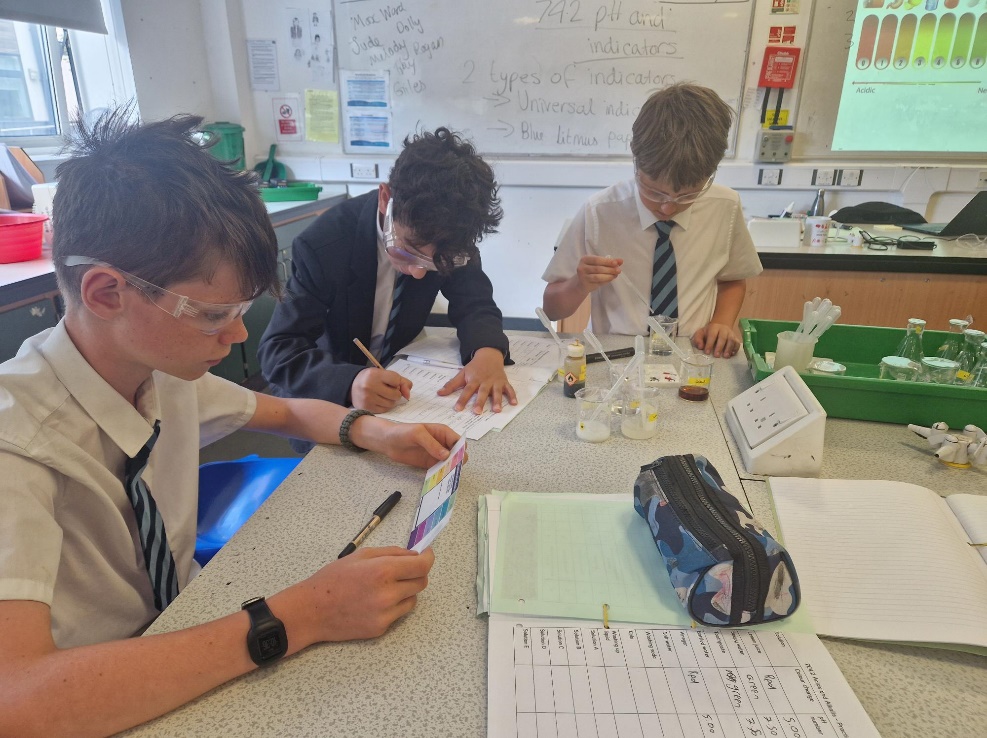 three boys in a school science lesson