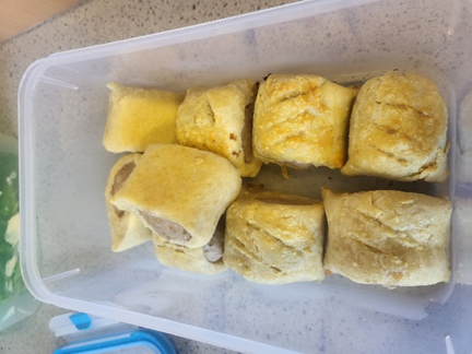 a tray of eight sausage rolls