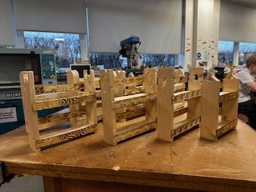 A group of wooden storage shelves on a table