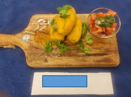 A wooden cutting board with food on it
