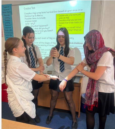 four students performing the Five Pillars of Islam