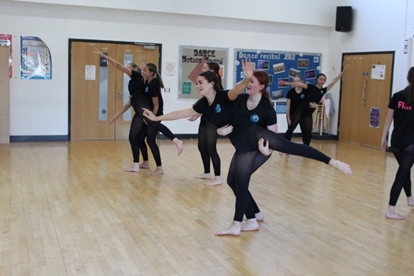 A group of students dancing in the dance studio