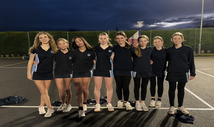 A group of girls in matching outfits