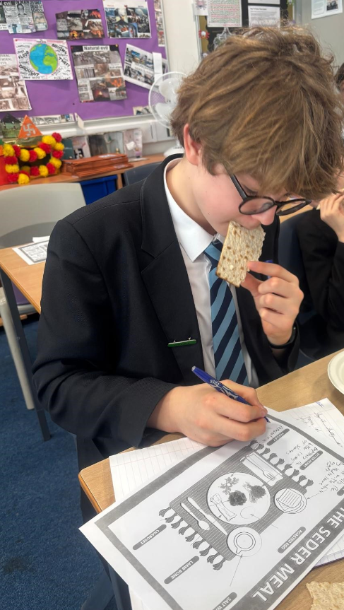a student enjoying the passover meal taster