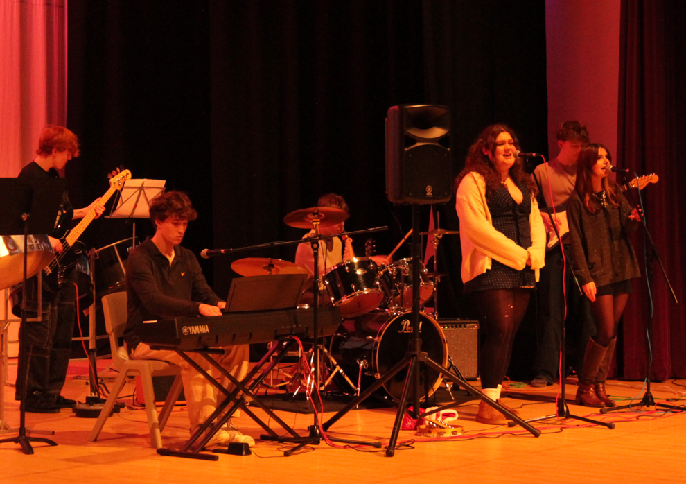 six students  performing at the music concert
