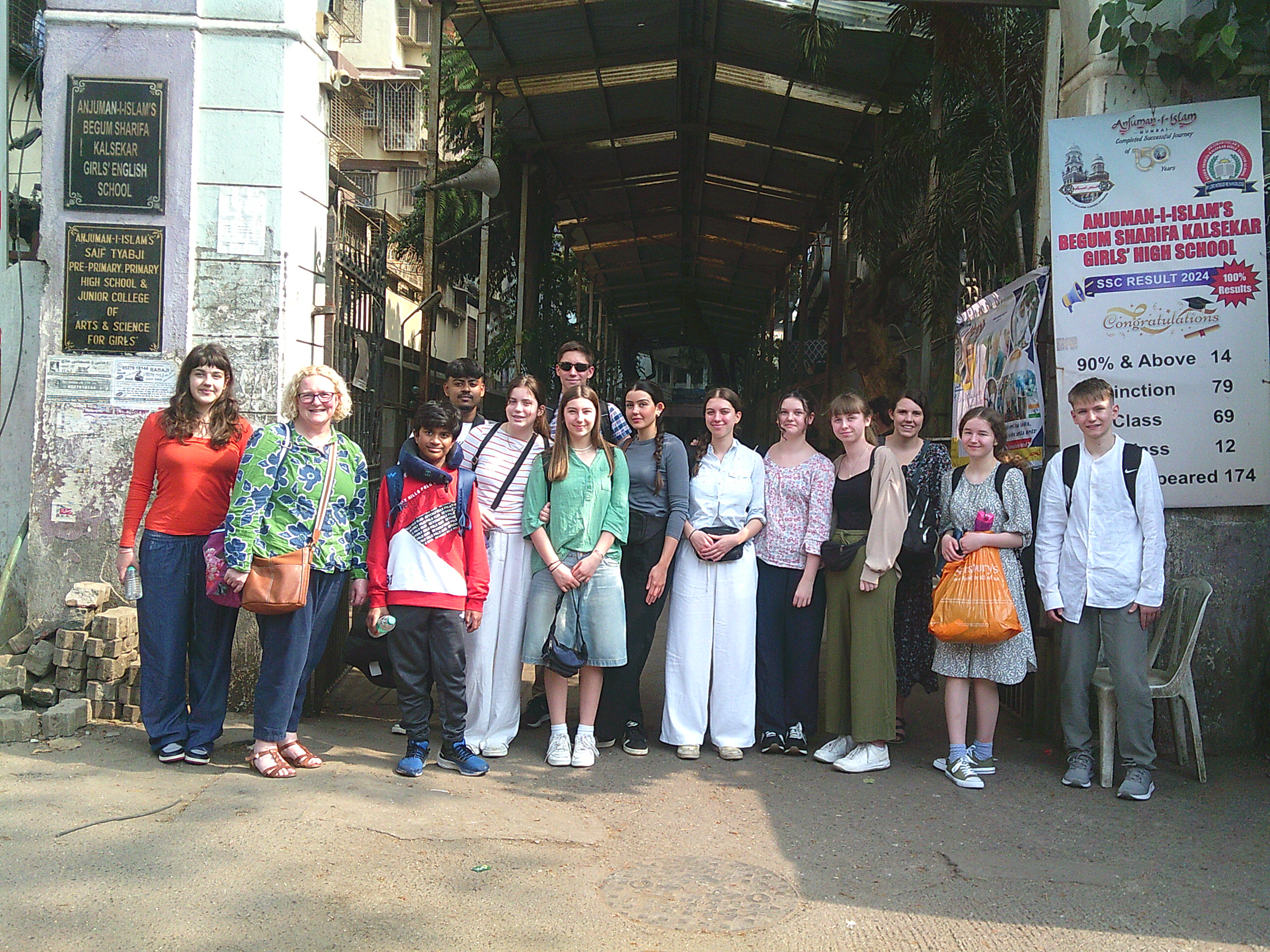 NLS STUDENTS AT THE SCHOOL ENTRANCE IN INDIAROOM IN INDIA