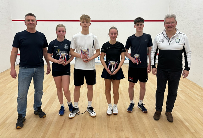 four NLS students at the squash championships