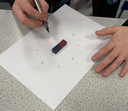 a magnet on a piece of paper