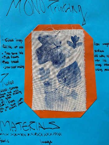 a folder of work  cover  - blue paper with a blue and white fabric with a blue border