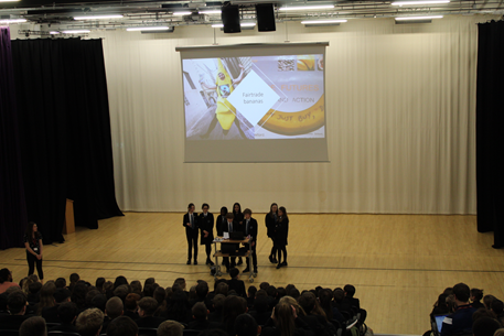 This image shows the International School Leaders presenting in assembly 