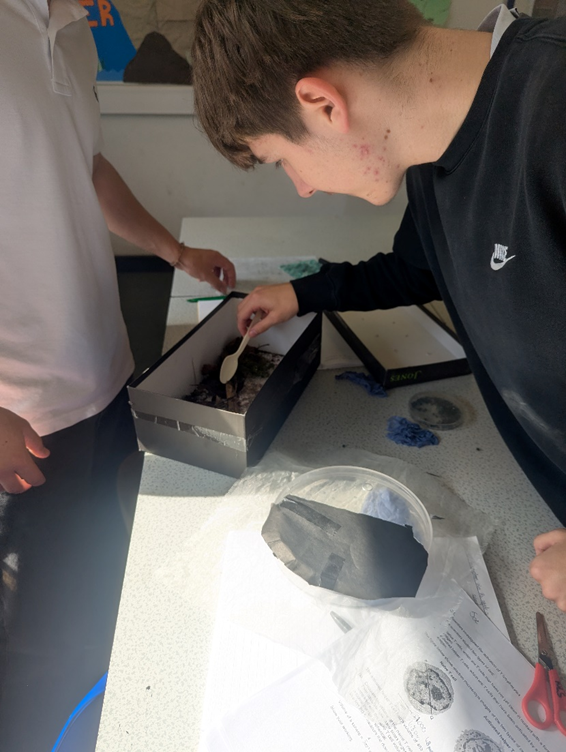 A person looking at a box with a spoon