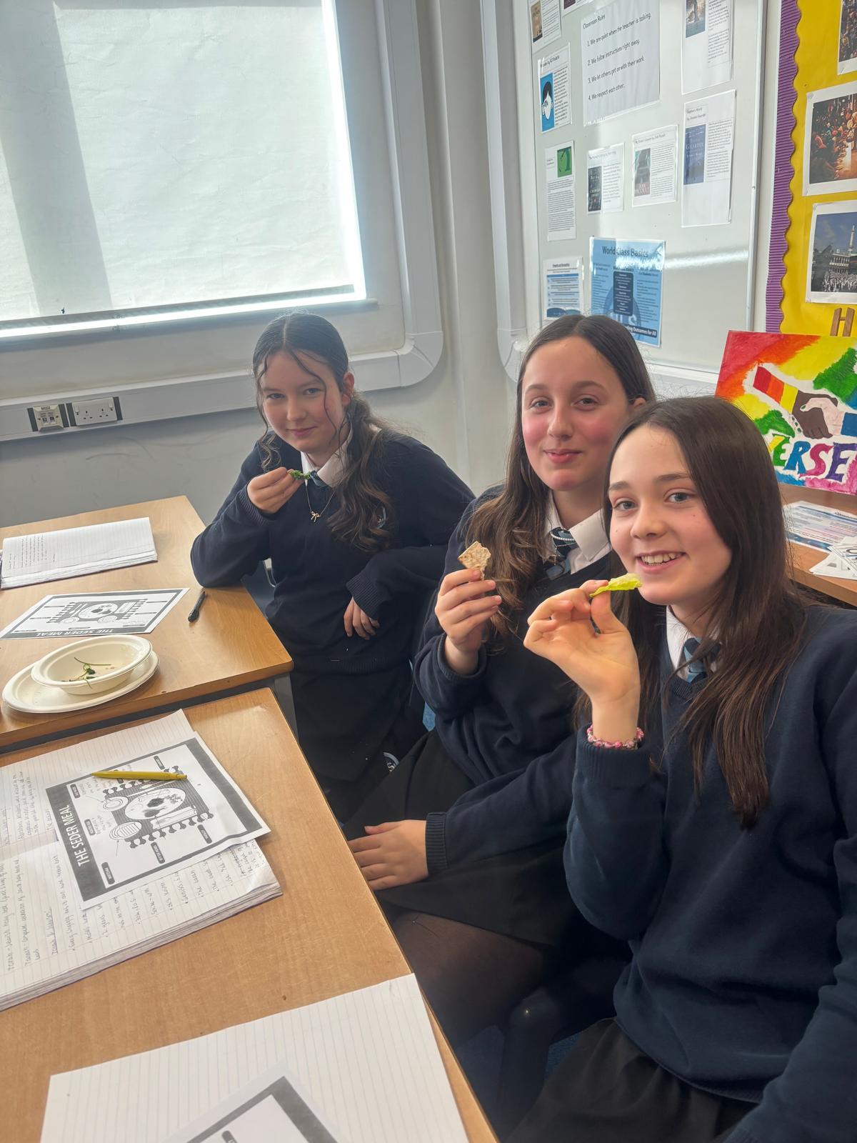 three girls enjoying the passover meal taster