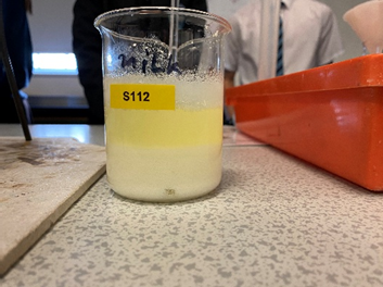 A close up of a container with milk