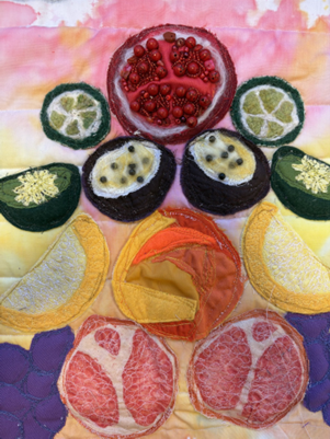 A close-up of a fabric  with various fruit