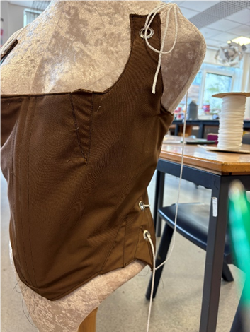 A brown top /shirt on a mannequin