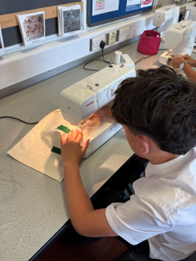 a student using a sewing machine