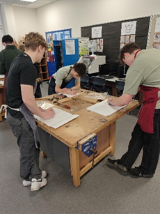 A group of people working on paper