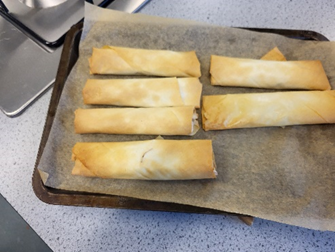 a tray of spring rolls