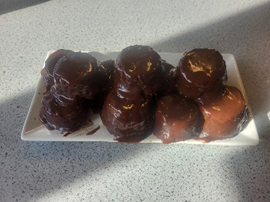 7 chocolate cakes on a white plate