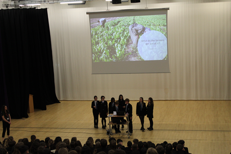 This image shows the International School Leaders presenting in assembly 