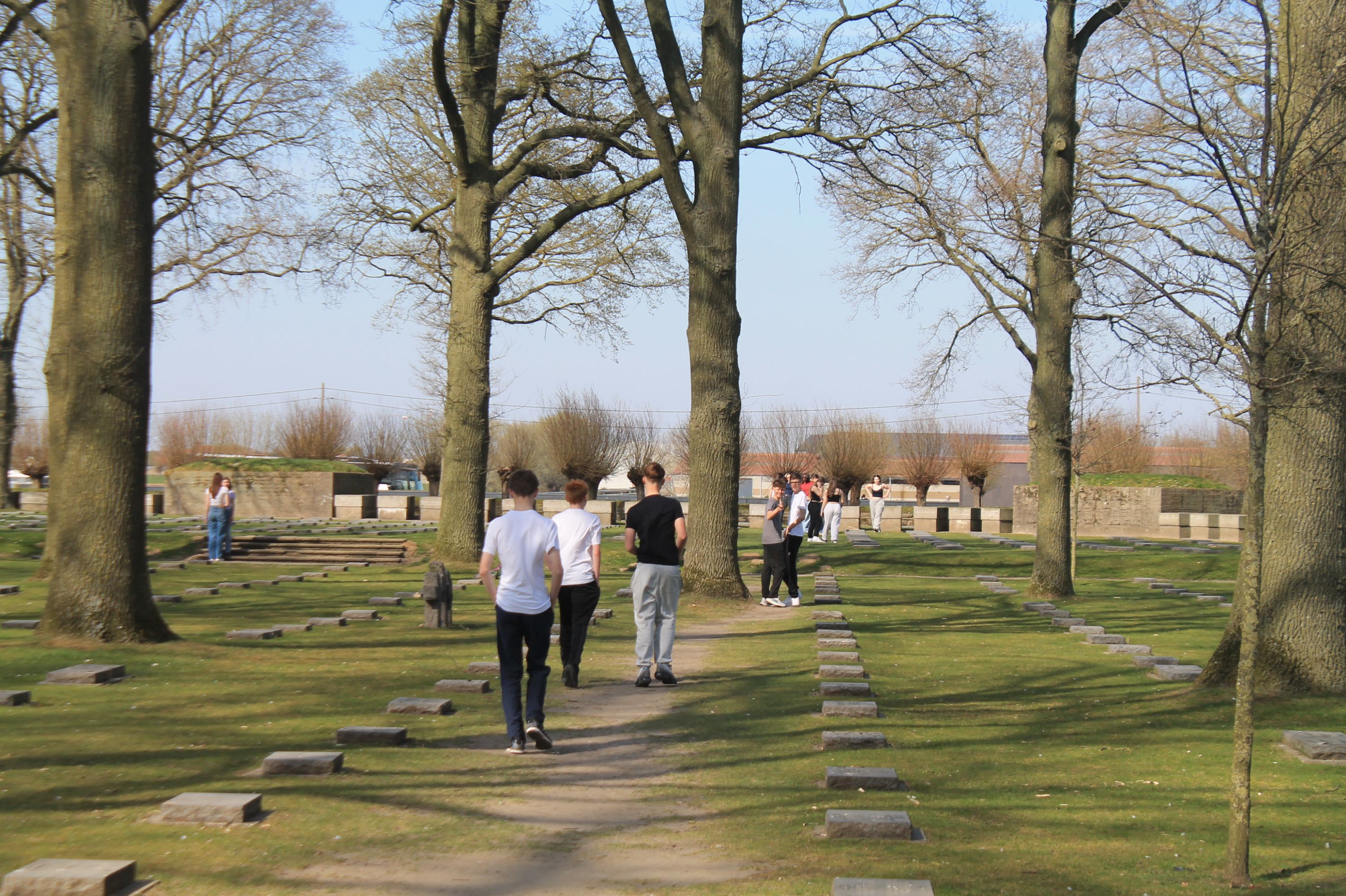Students walking through a cemetery