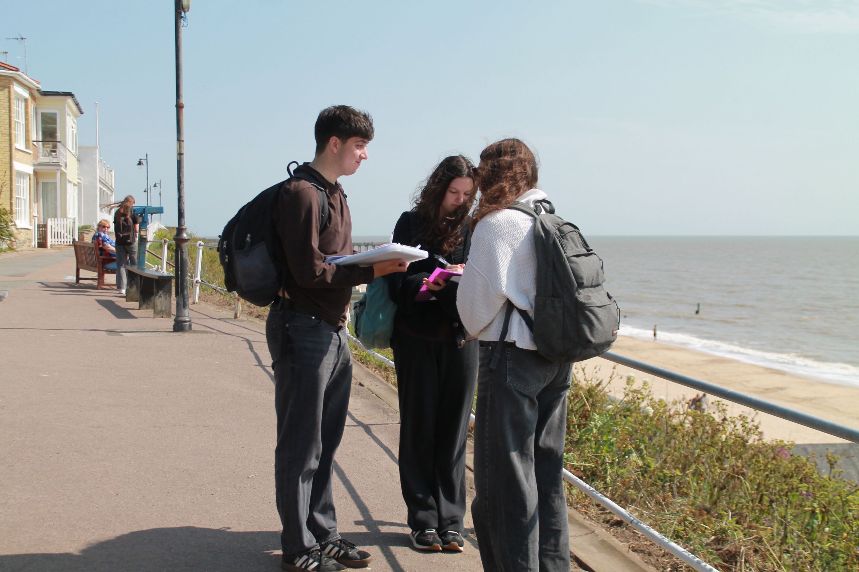 three studnets carrying out analysis work