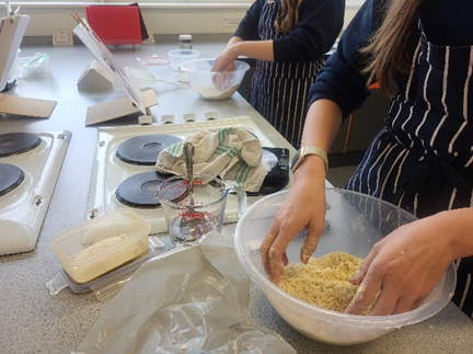 A person mixing pastry in a bowl