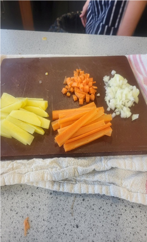A cutting board with vegetables on it