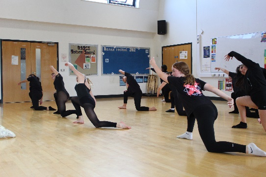 A GROUP OF STUDENTS DANCING 