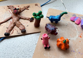 A group of clay animal figures on a table