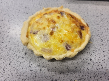 A small quiche on a counter