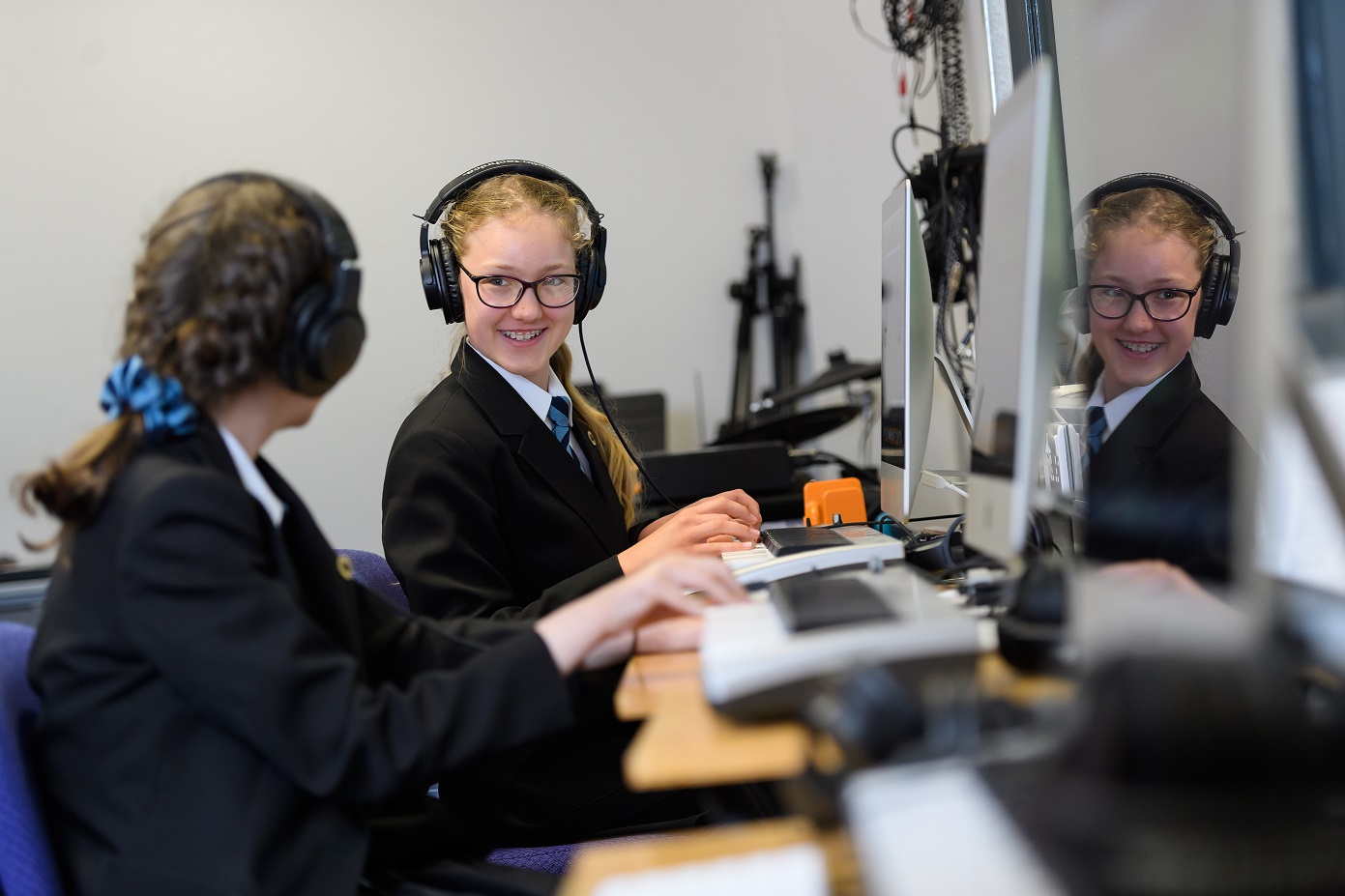 Two students using the facilities in the IT department