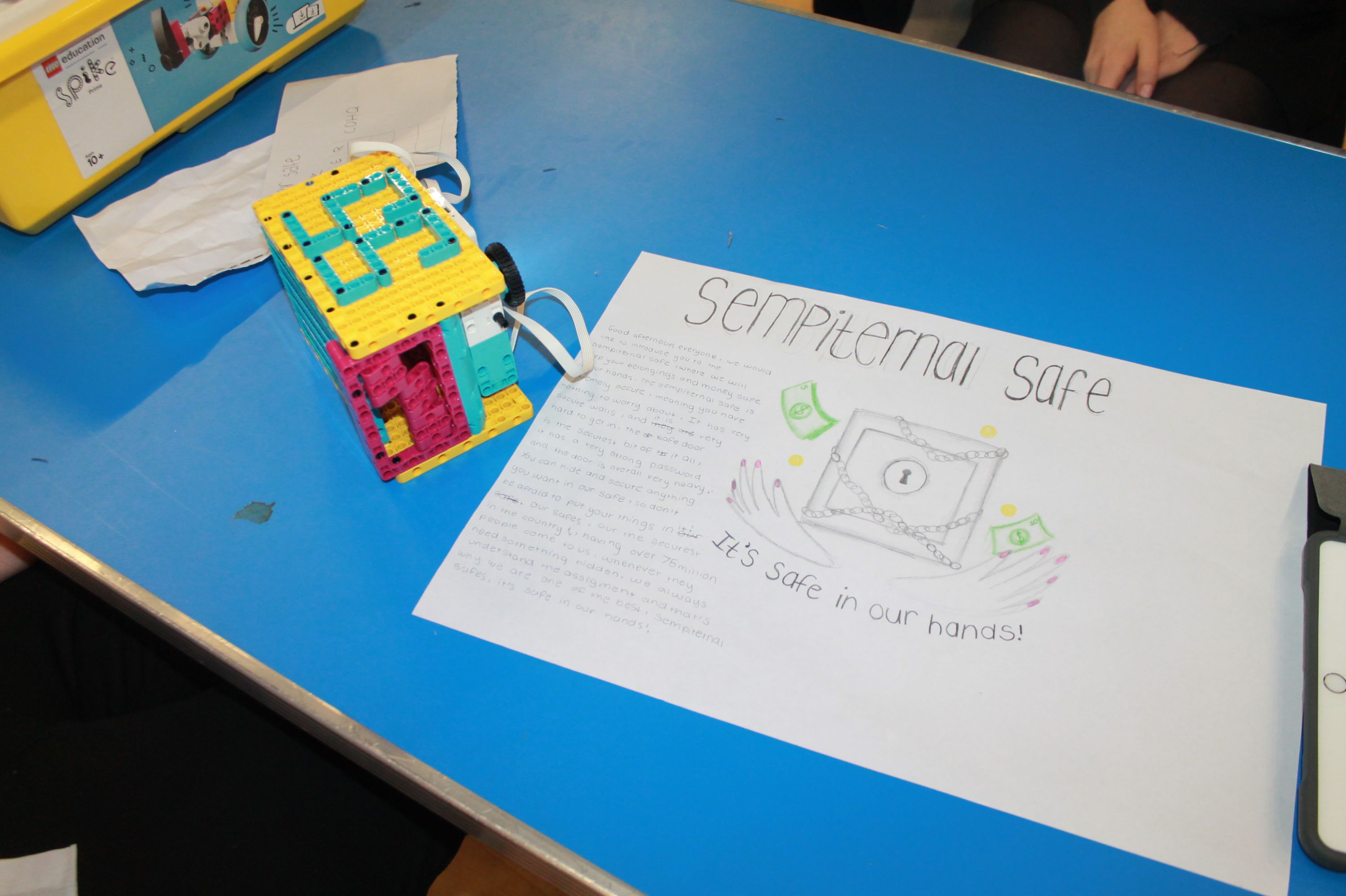 a completed model and a piece of paper describing the model 