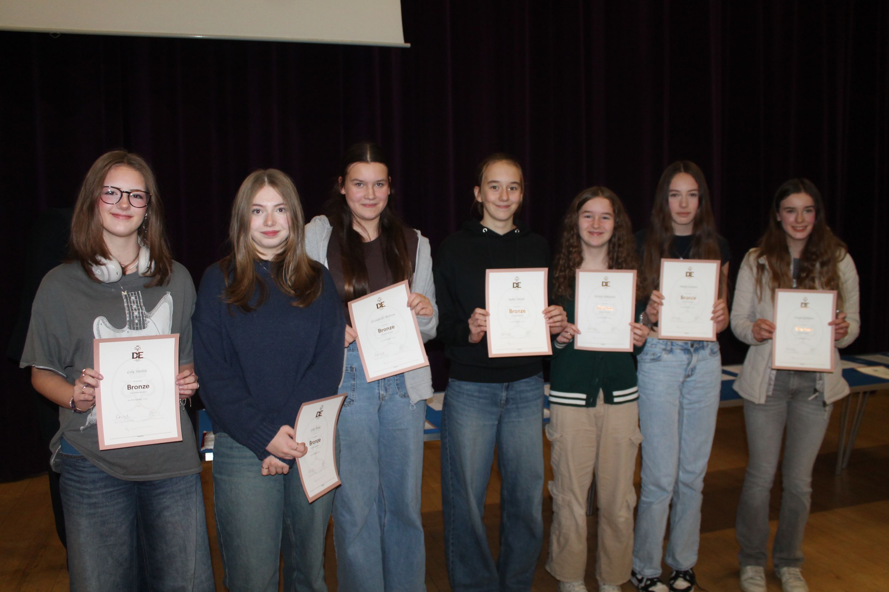 seven students holding their DofE Certificates