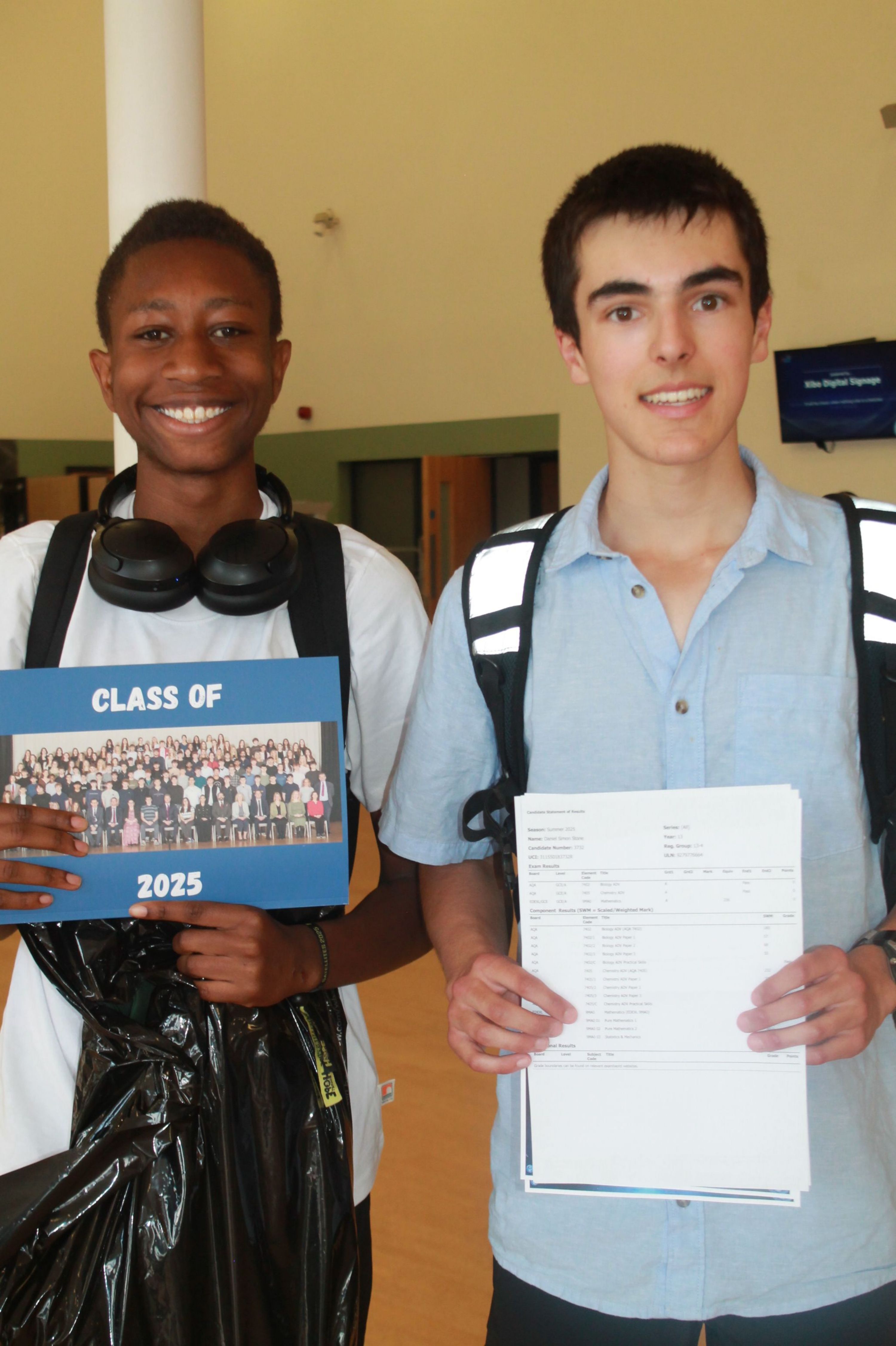 two students celebrating their A Level Results