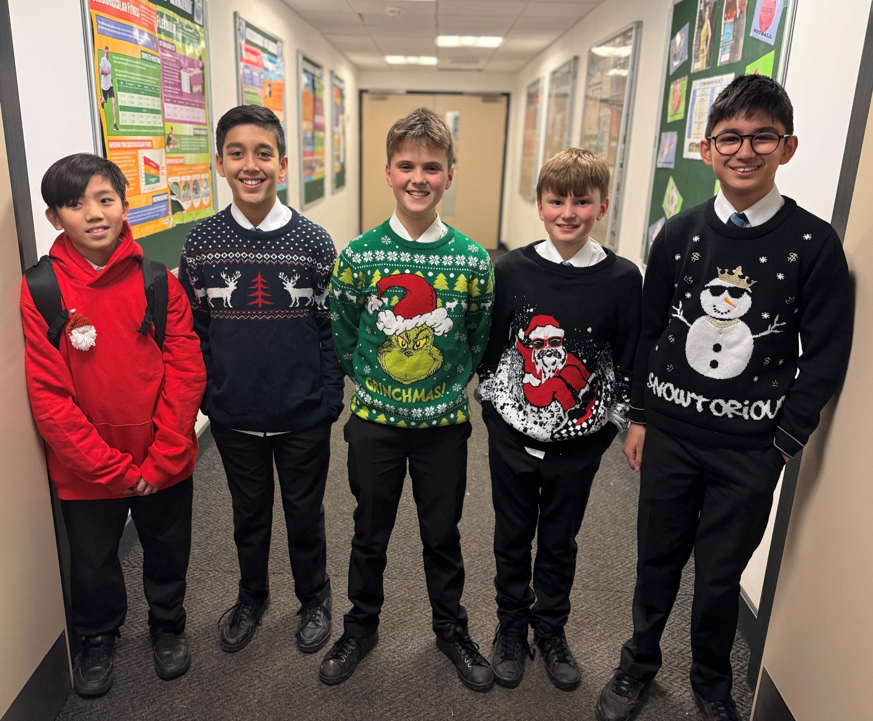 Five  students wearing Christmas Jumpers  