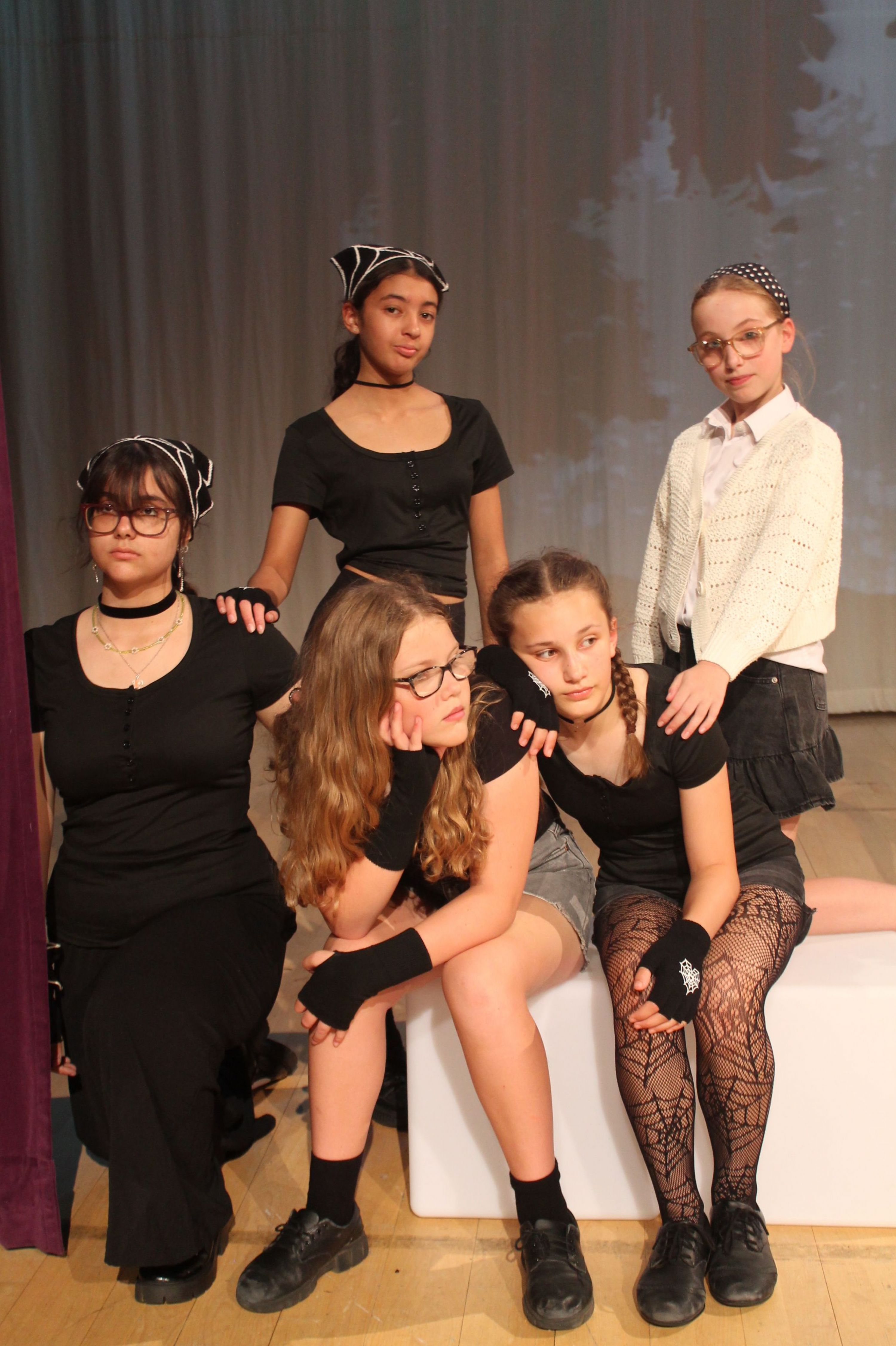 five of the cast of the production