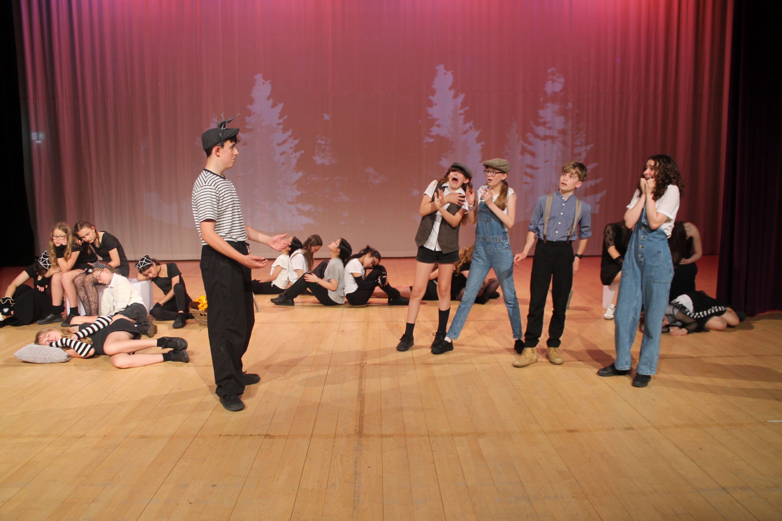 cast of the production in a scene