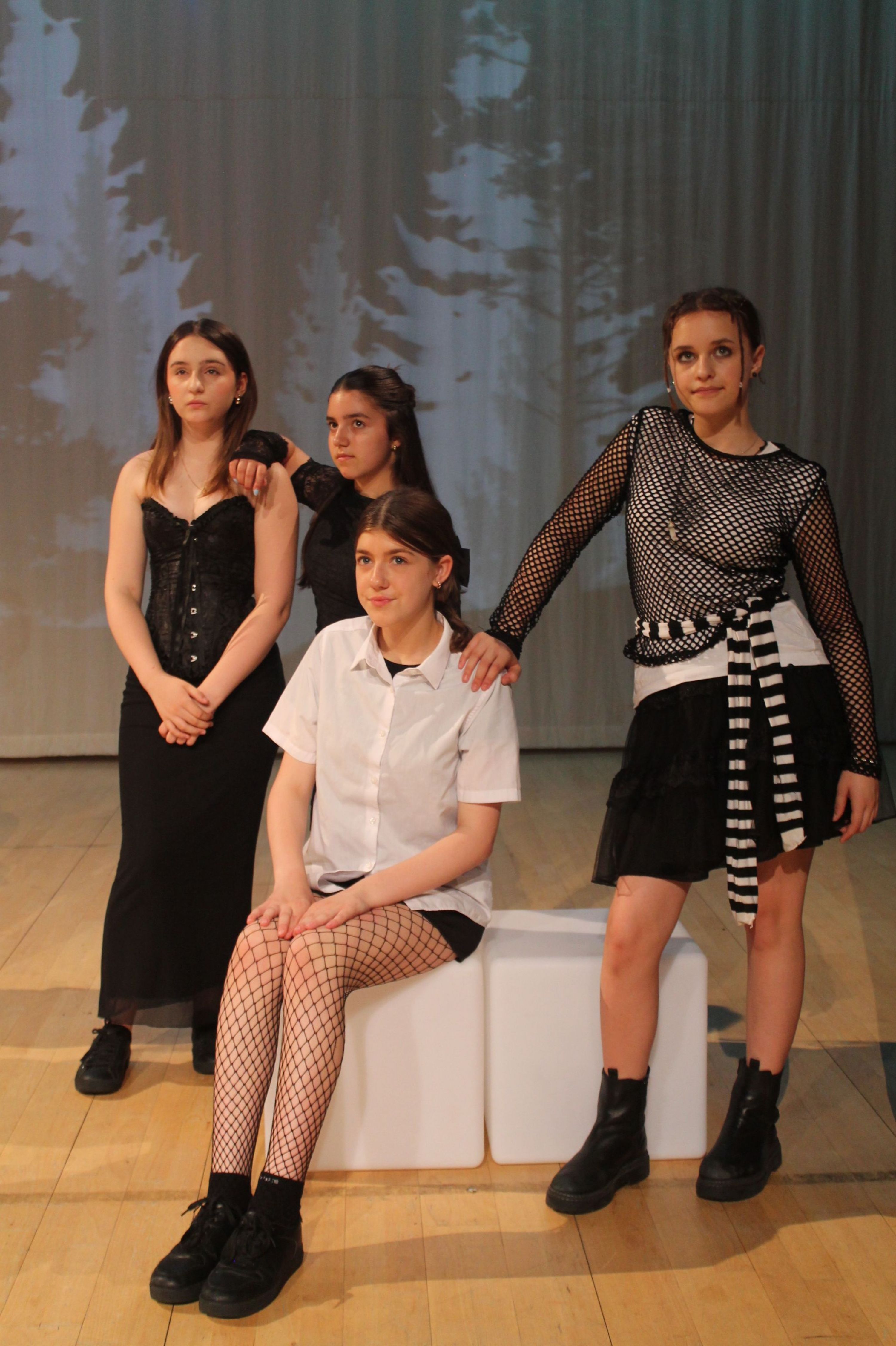 four of the cast of the production