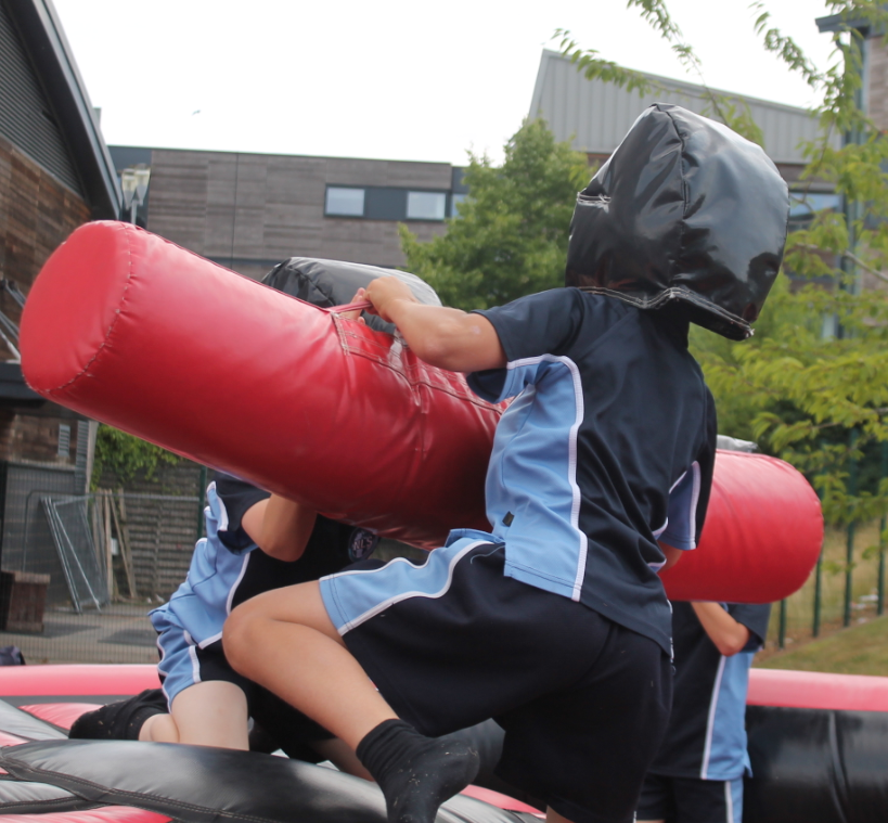 two students enjoying the inflatable