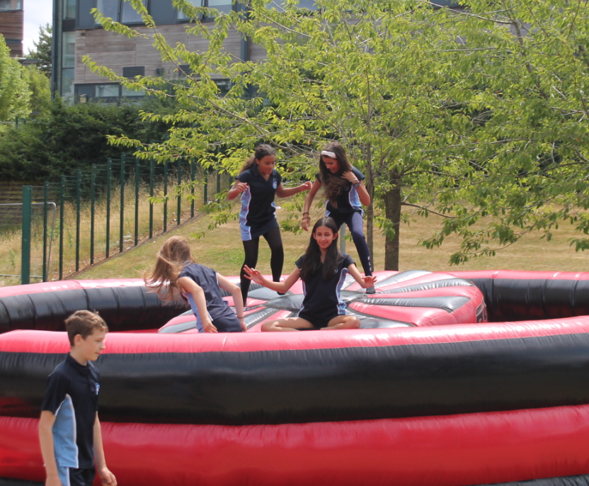 four students on the inflable