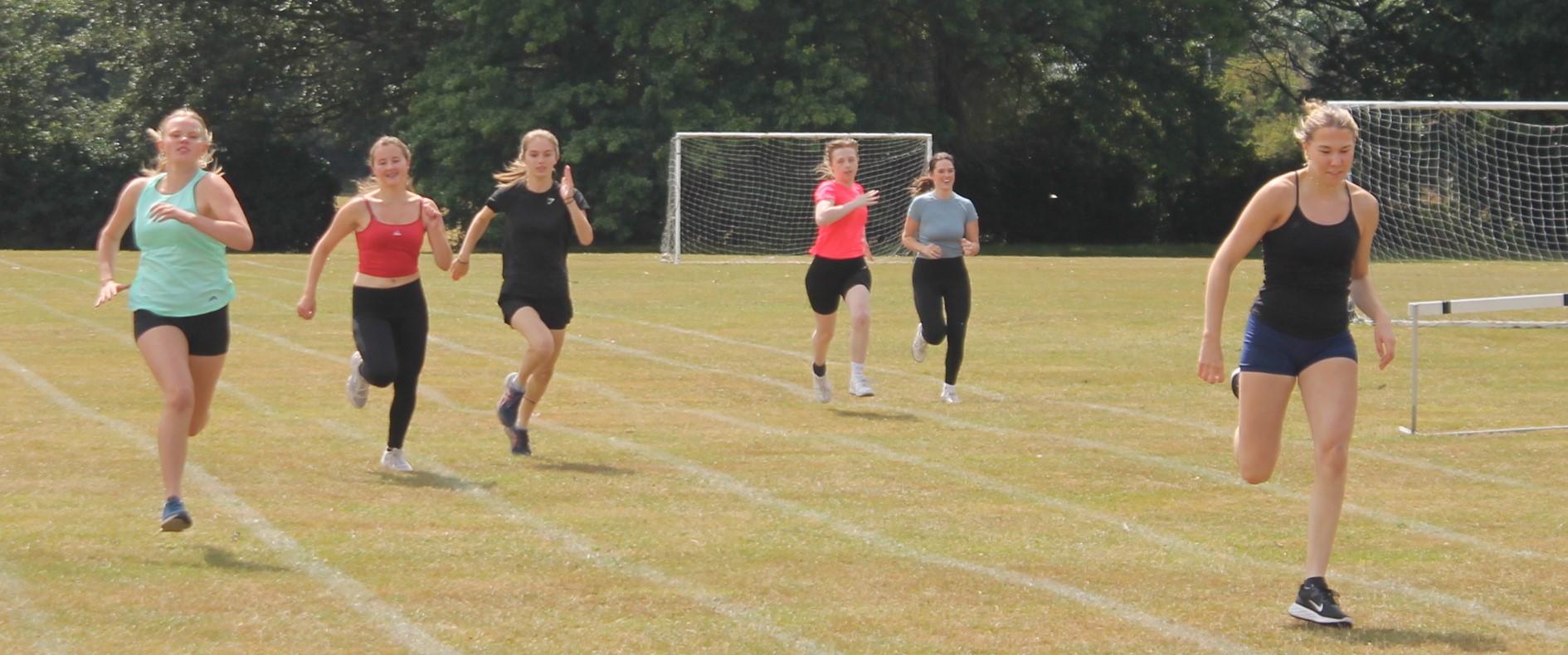 six students running in a race