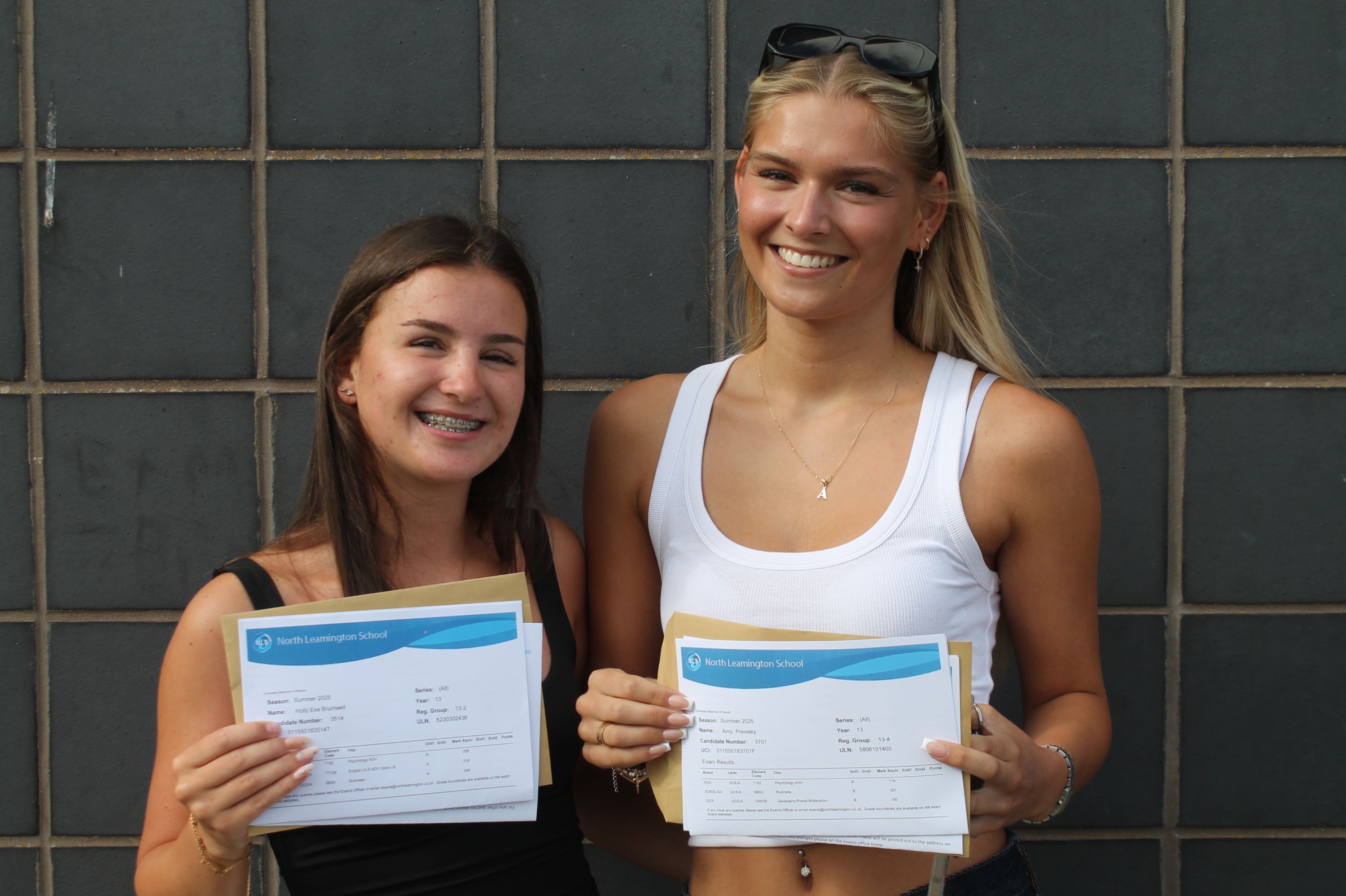 two students celebrating their A Level Results 